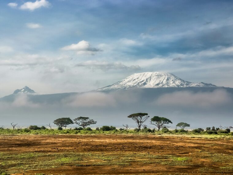 Snow-capped Mount Kilimanjaro rising above the clouds
